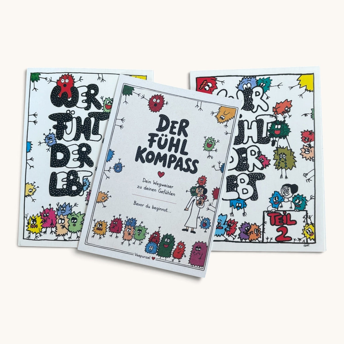 Beide Kartenbücher mit Fühlkompass